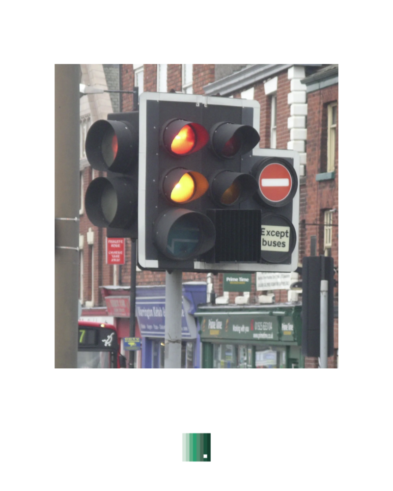 A traffic light showing red and amber, the cover image for the article ...And good design disappears
