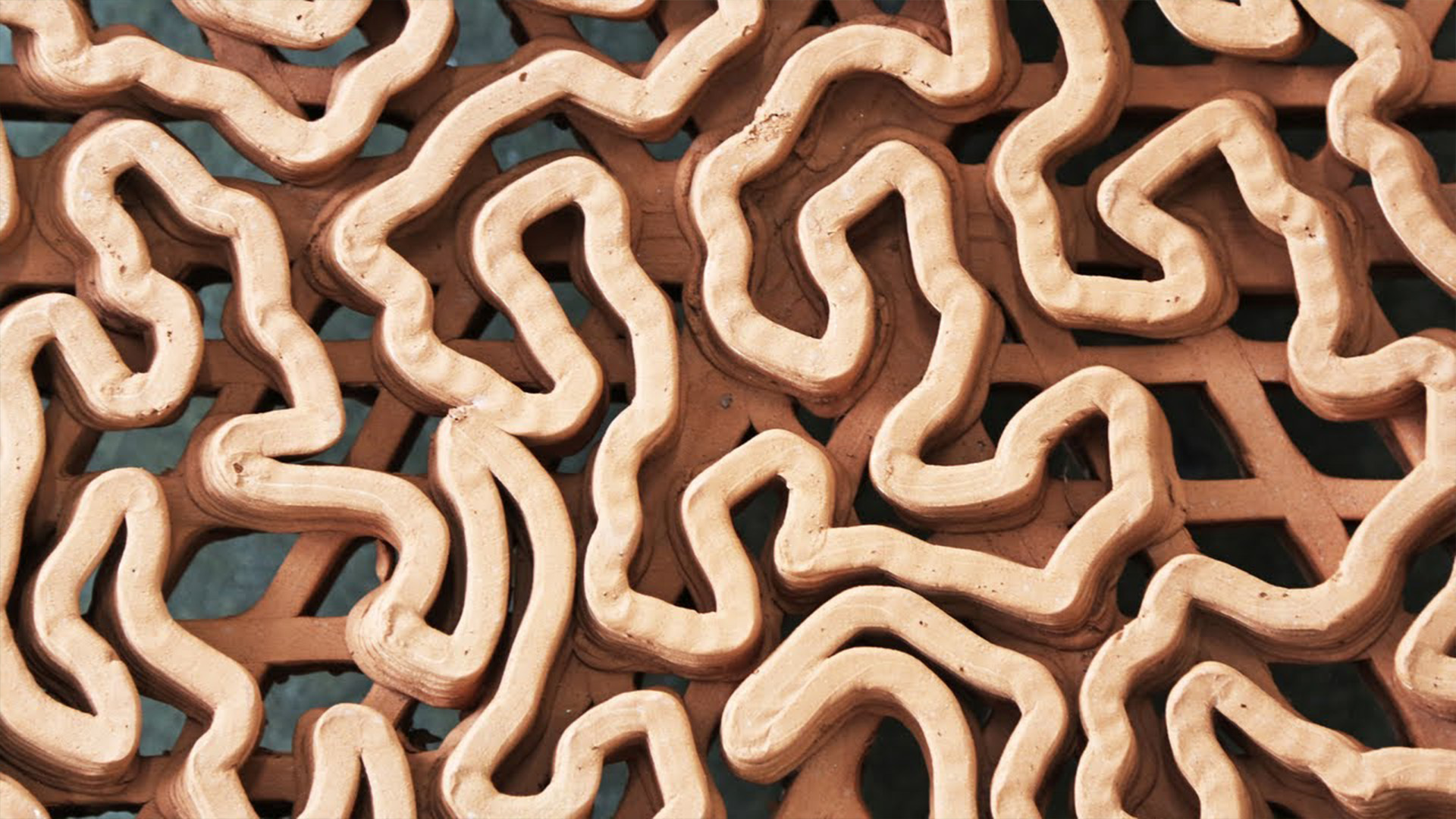 Macro detail of a 3D-printed terracotta reef tile's biomimetic structure